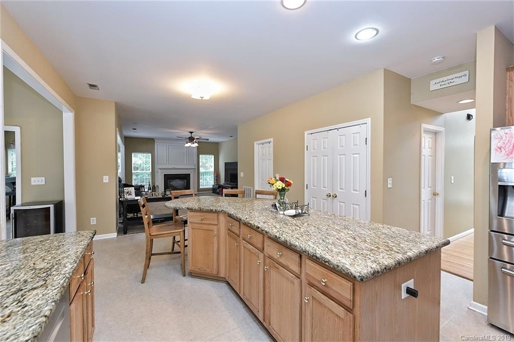 255 Choate Avenue Fort Mill, SC 29708 - Photo 11 of 38 a kitchen with center island table and chairs