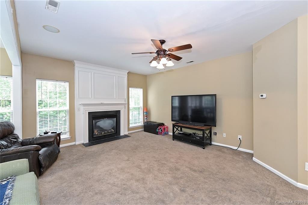 255 Choate Avenue Fort Mill, SC 29708 - Photo 12 of 38 a living room with furniture flat screen tv and a fireplace