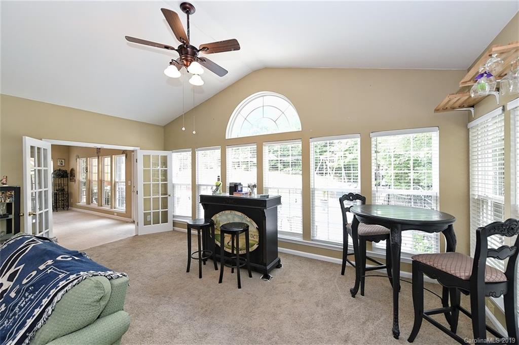 255 Choate Avenue Fort Mill, SC 29708 - Photo 16 of 38 a living room with furniture a fireplace and a large window