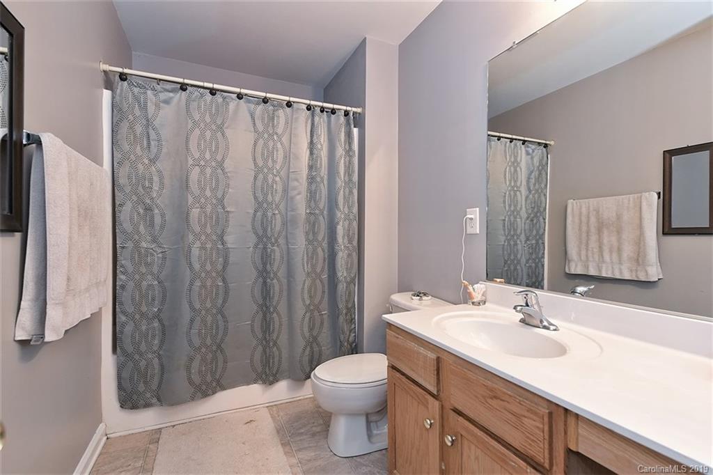 255 Choate Avenue Fort Mill, SC 29708 - Photo 22 of 38 a bathroom with a granite countertop sink toilet and shower