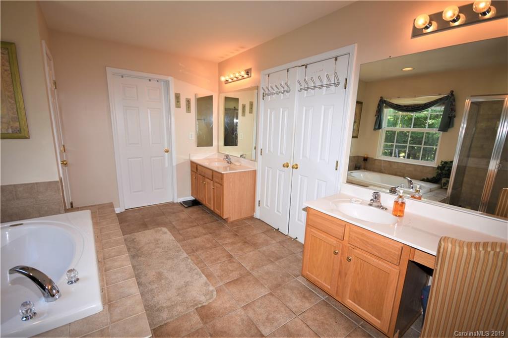 255 Choate Avenue Fort Mill, SC 29708 - Photo 27 of 38 a bathroom with a tub sink and mirror