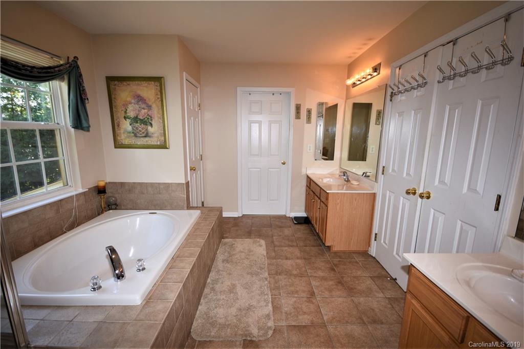 255 Choate Avenue Fort Mill, SC 29708 - Photo 30 of 38 a bathroom with a tub sink and mirror