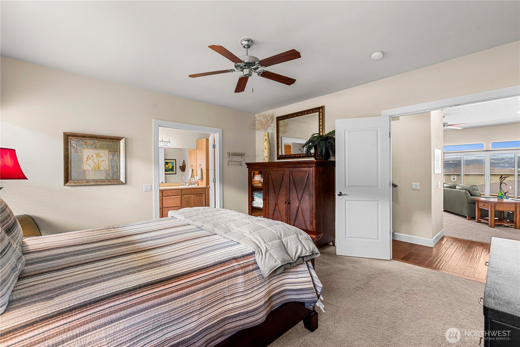 9122 Red Hawk Lane Northwest, Unit A76 Quincy, WA 98848 - Photo 18 of 40 a bedroom with a bed and a chandelier