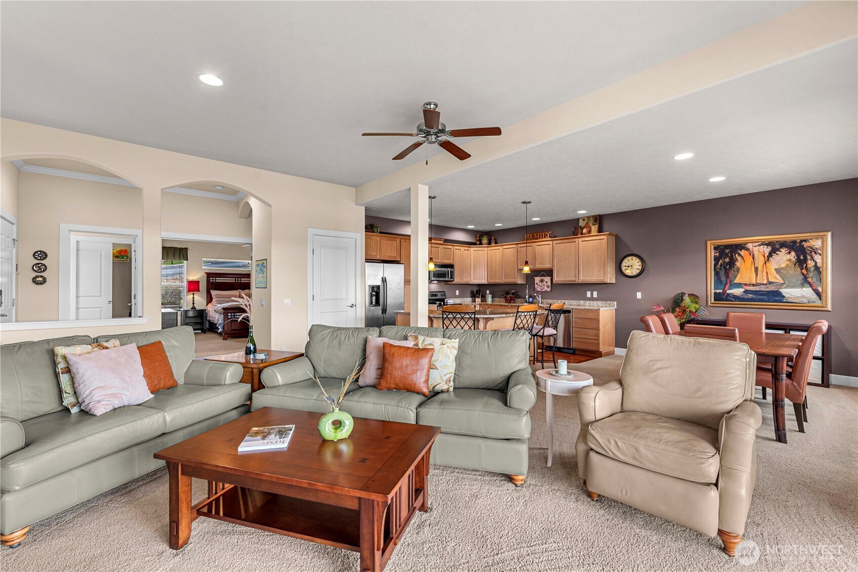 9122 Red Hawk Lane Northwest, Unit A76 Quincy, WA 98848 - Photo 8 of 40 a living room with furniture kitchen view and a chandelier