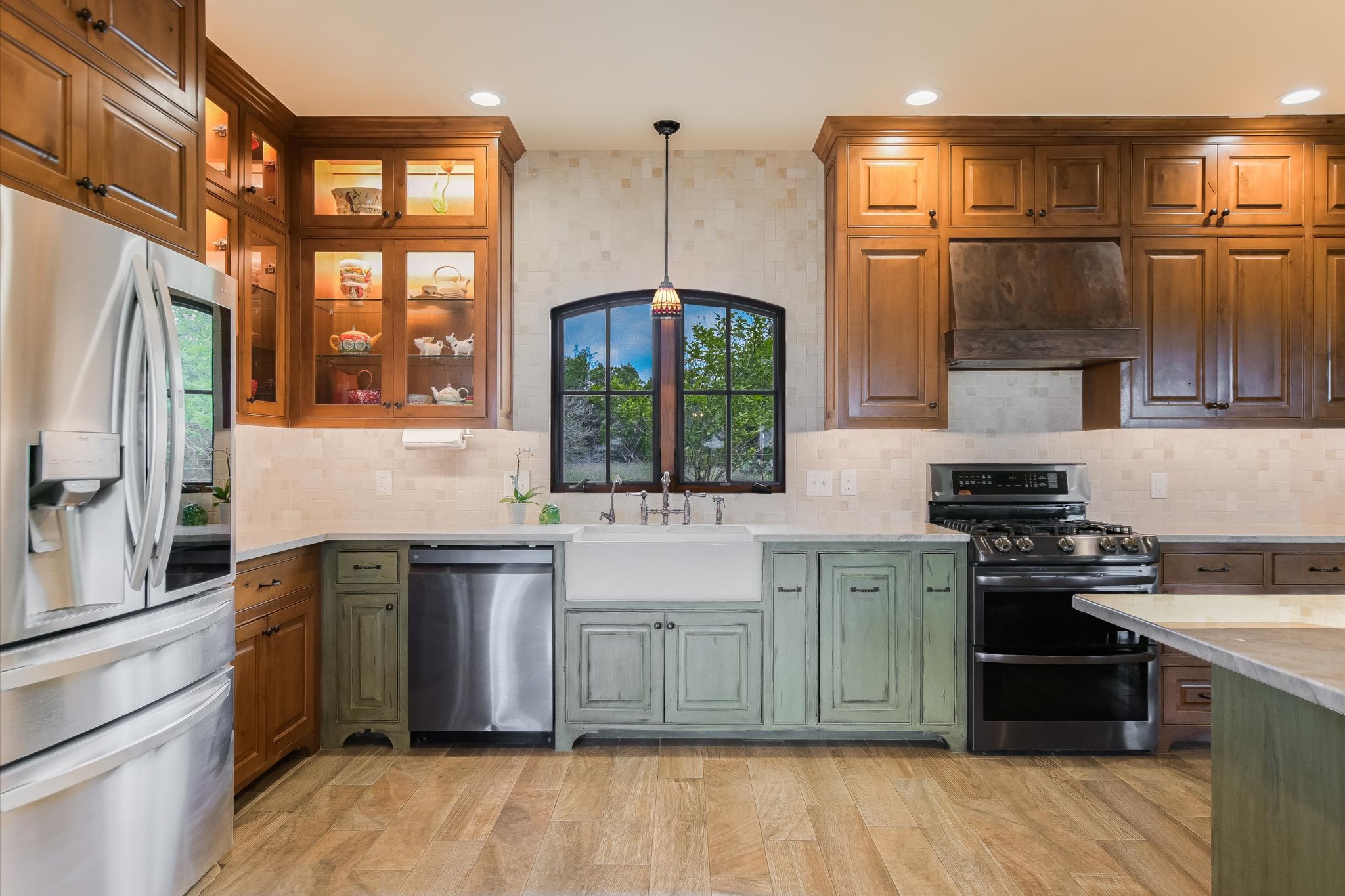590 Rancho Grande Drive Wimberley, TX 78676 - Photo 12 of 30 a kitchen with stainless steel appliances granite countertop a stove a sink dishwasher a refrigerator and a microwave oven with granite countertops