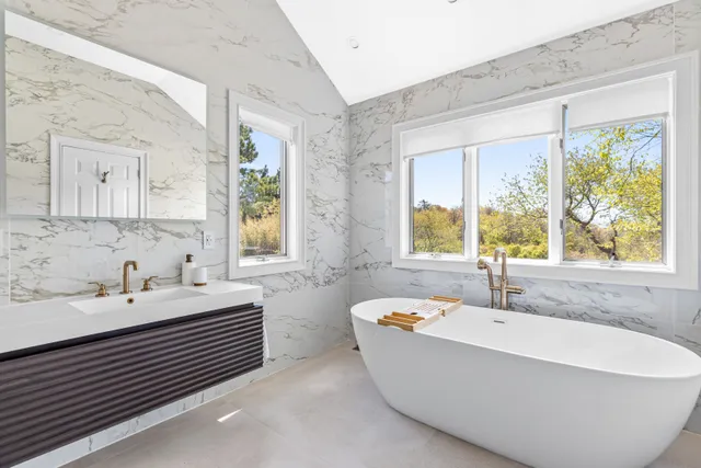 a bathroom with a bathtub and a sink