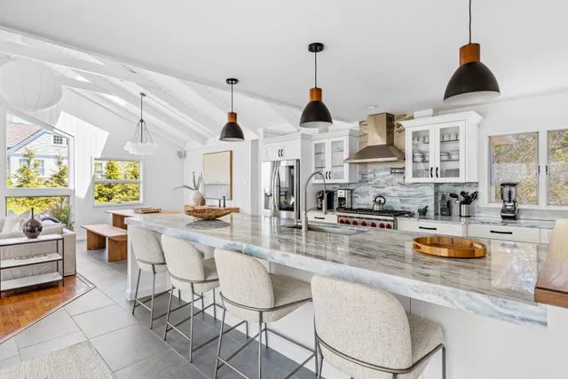 a kitchen with stainless steel appliances a sink and cabinets