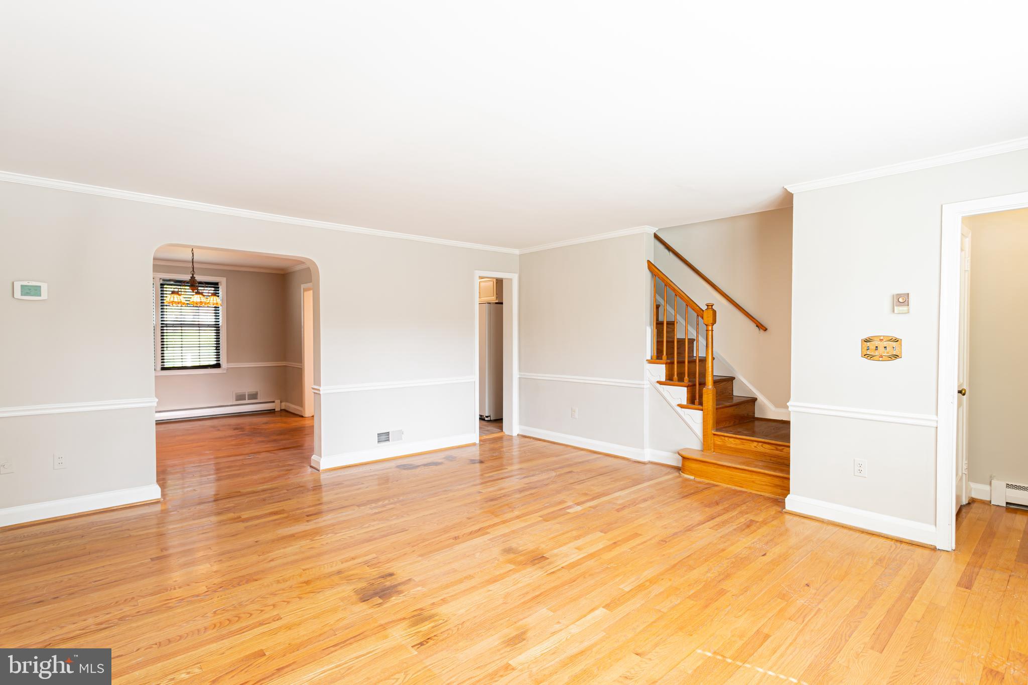8426 Pleasant Plains Road Towson, MD 21286 - Photo 4 of 25 a view of an empty room with wooden floor and entryway