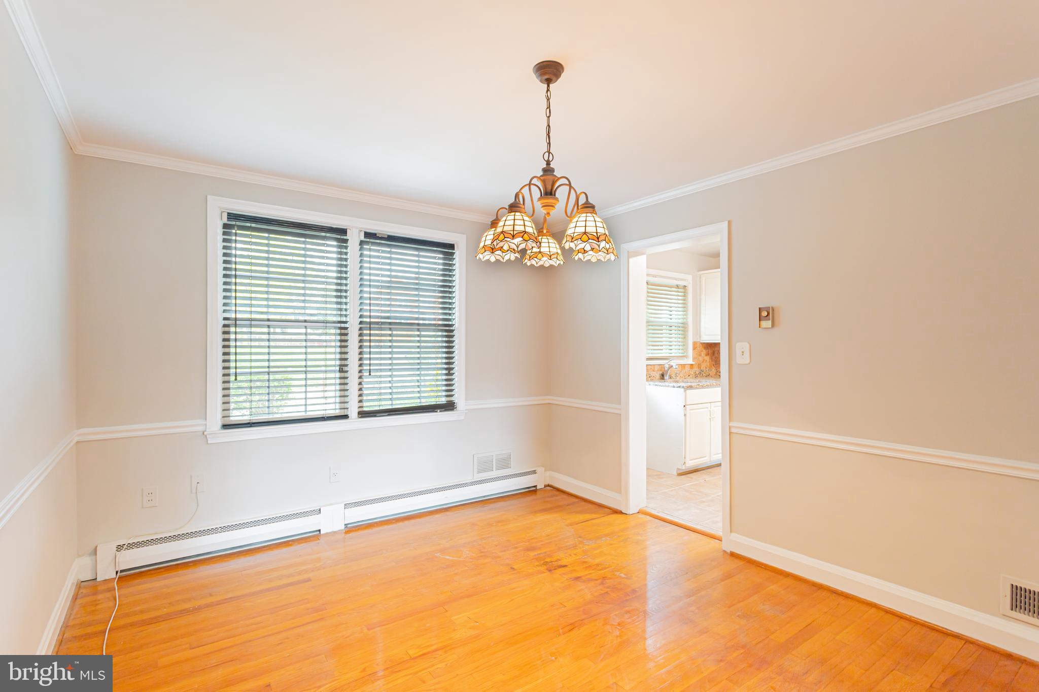 8426 Pleasant Plains Road Towson, MD 21286 - Photo 5 of 25 a view of an empty room with windows