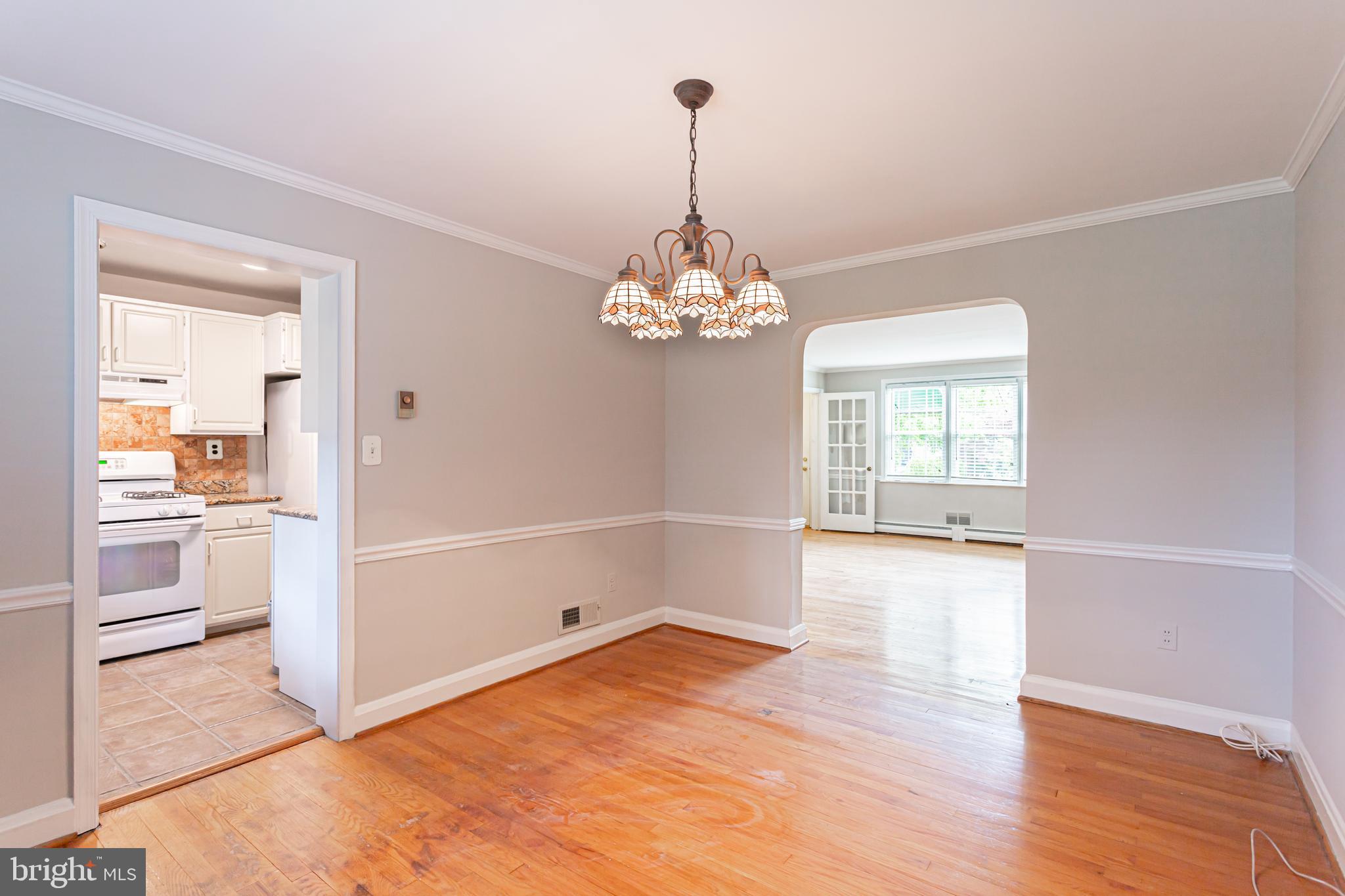 8426 Pleasant Plains Road Towson, MD 21286 - Photo 6 of 25 a view of a room with window and wooden floor
