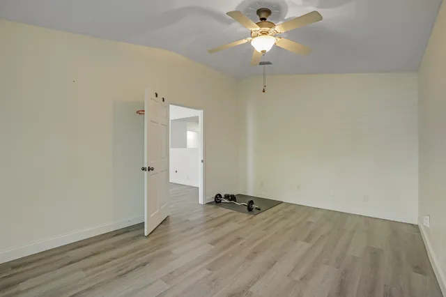 a view of a livingroom with furniture and wooden floor