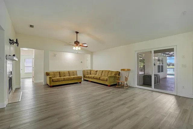 a view of a livingroom with furniture and a flat screen tv