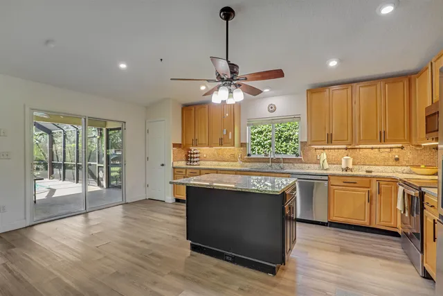 a open kitchen with a table and chairs