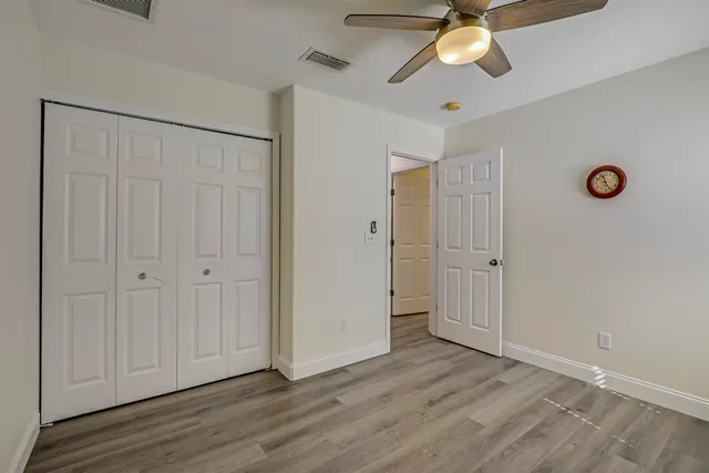 a living room with a bed furniture and a window
