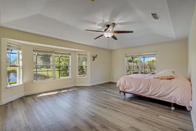a view of bathroom with a toilet sink and mirror