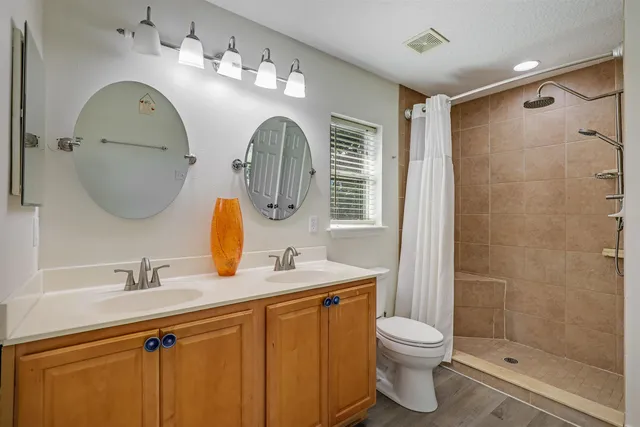 a bathroom with a glass shower door