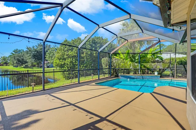 a view of pool with a backyard