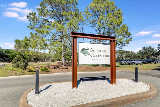 a front view of a house with a yard and balcony