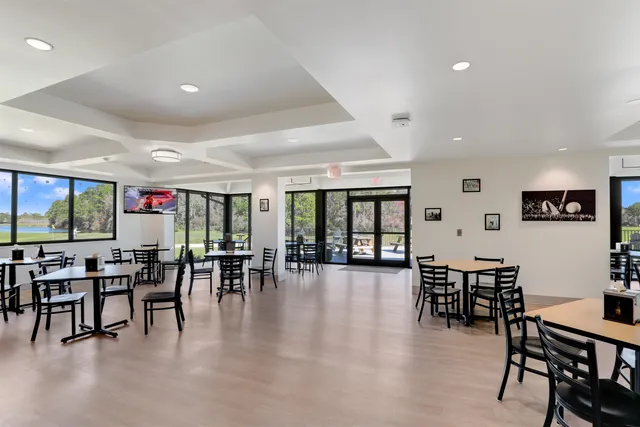 a view of a backyard with a garden and entertaining space