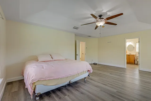 a swimming pool with some trees in the background