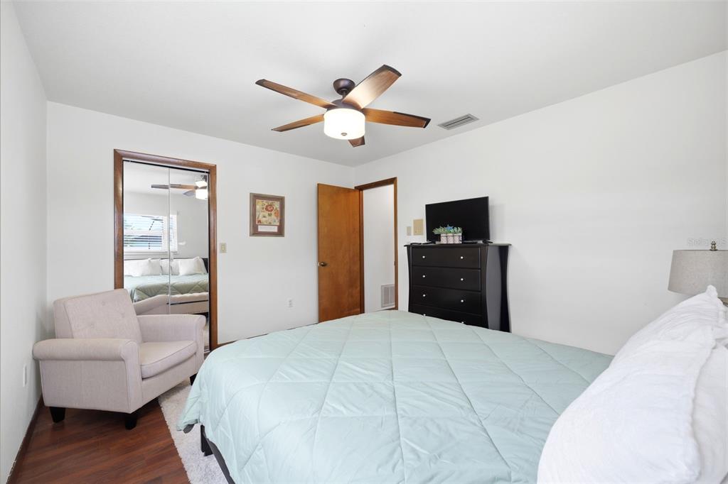 5227 Suwannee Road Weeki Wachee, FL 34607 - Photo 32 of 62 a bedroom with a bed and a couch