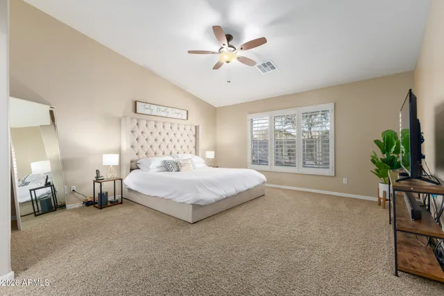 a view of walk in closet with clothes