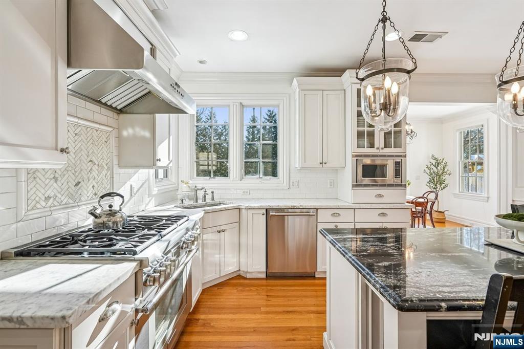 9 Mt Vernon Road Montclair, NJ 07043 - Photo 11 of 46 a kitchen with stainless steel appliances granite countertop a stove and a sink