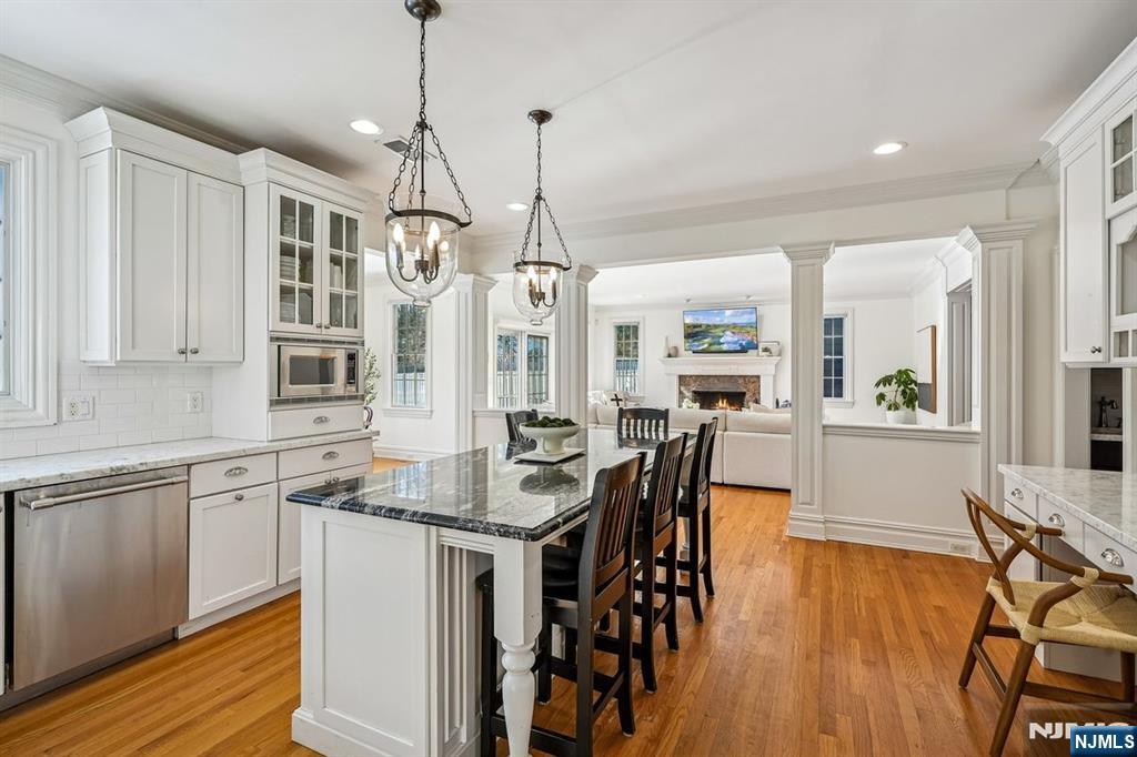 9 Mt Vernon Road Montclair, NJ 07043 - Photo 14 of 46 a kitchen with stainless steel appliances granite countertop a kitchen island hardwood floor and a sink
