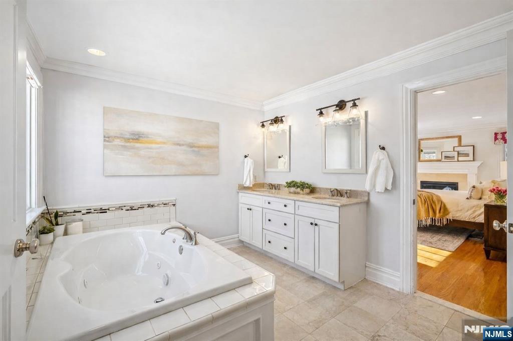 9 Mt Vernon Road Montclair, NJ 07043 - Photo 21 of 46 a spacious bathroom with a tub sink and mirror