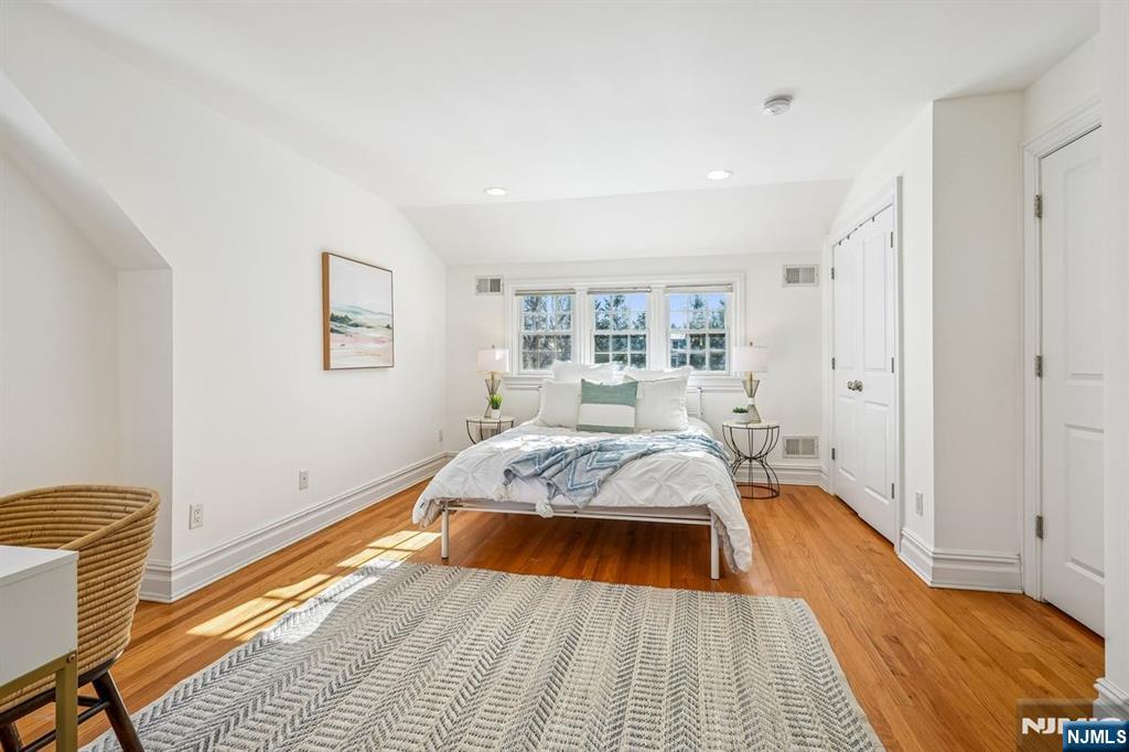 9 Mt Vernon Road Montclair, NJ 07043 - Photo 24 of 46 a bed sitting in a spacious bedroom next to a window