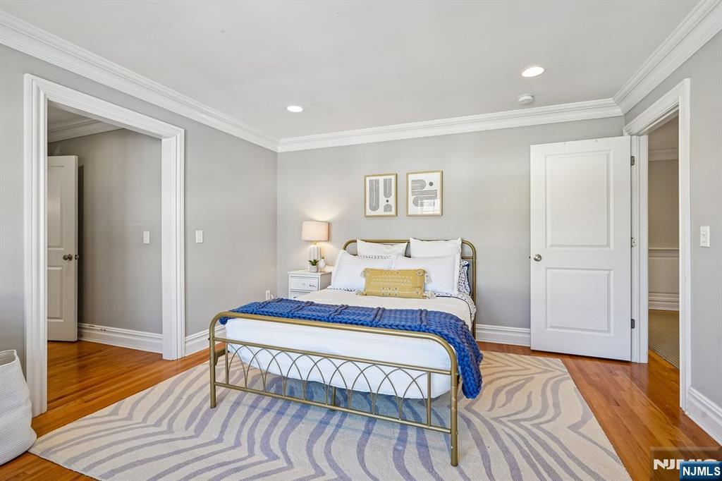 9 Mt Vernon Road Montclair, NJ 07043 - Photo 25 of 46 a bedroom with a bed and wooden floor