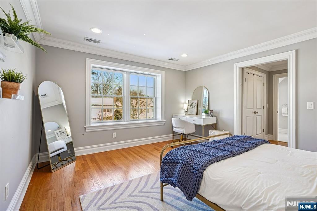 9 Mt Vernon Road Montclair, NJ 07043 - Photo 26 of 46 a bedroom with a bed wooden floor and window