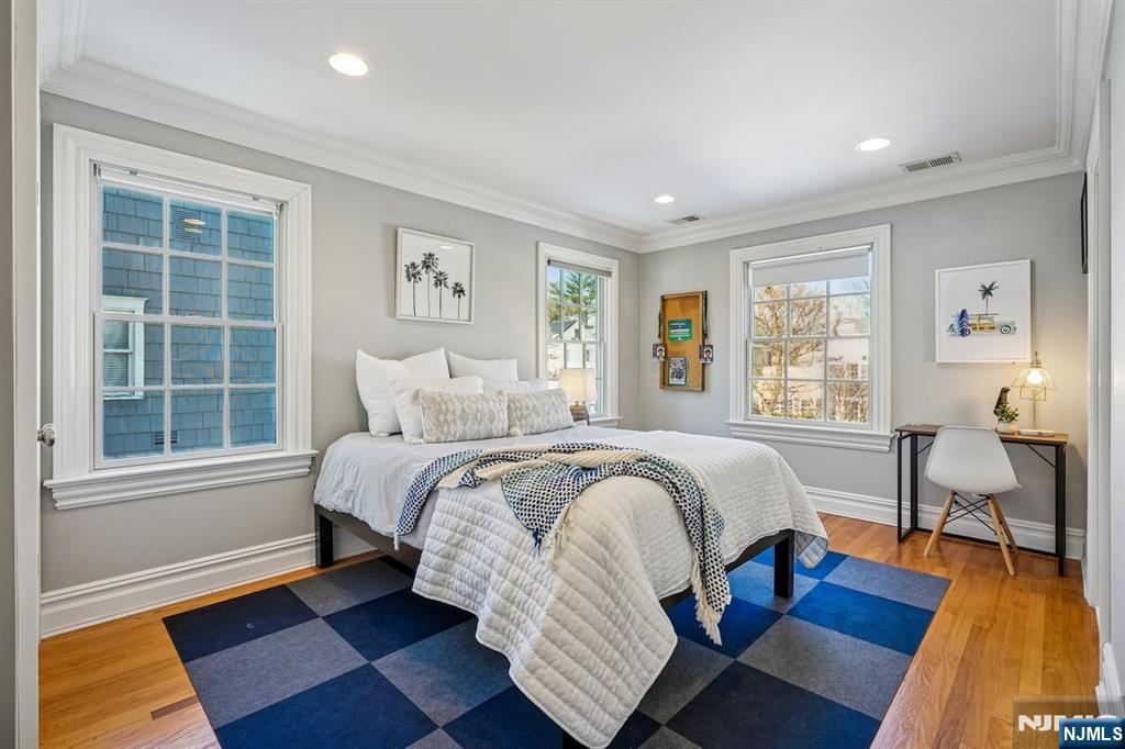 9 Mt Vernon Road Montclair, NJ 07043 - Photo 28 of 46 a bed room with a bed and a chair