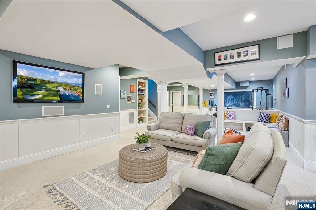 9 Mt Vernon Road Montclair, NJ 07043 - Photo 32 of 46 a living room with furniture and a flat screen tv