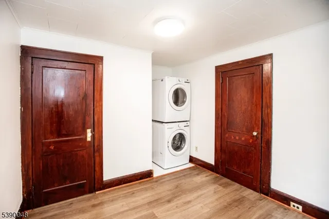 a view of an empty room with wooden door