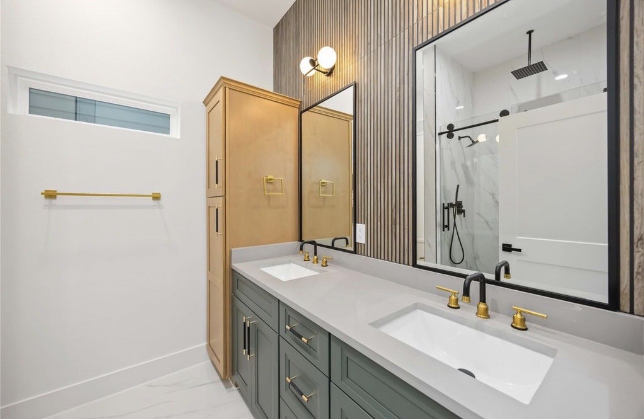 8011 Cora Street, Unit A Houston, TX 77088 - Photo 10 of 14 a bathroom with a sink and a mirror