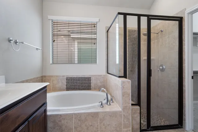 a bathroom with a bathtub and a sink