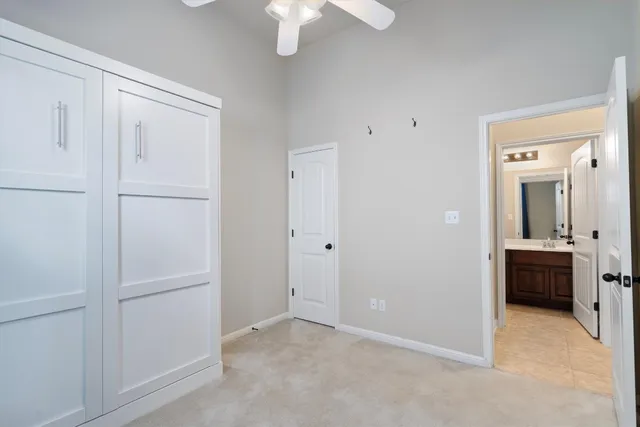 a view of an empty room with a bathroom