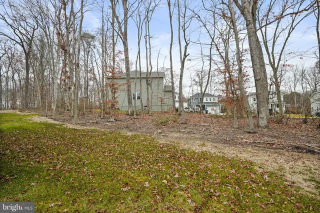 a house view with a backyard space