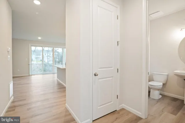 a view of a bathroom with toilet and a tub