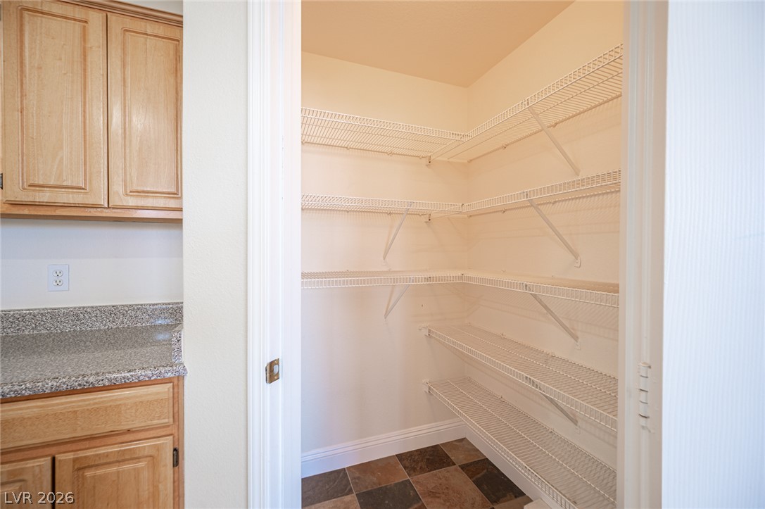 8555 West Russell Road, Unit 2062 Las Vegas, NV 89113 - Photo 19 of 35 Organized wire shelving provides ample storage in this well-appointed pantry.