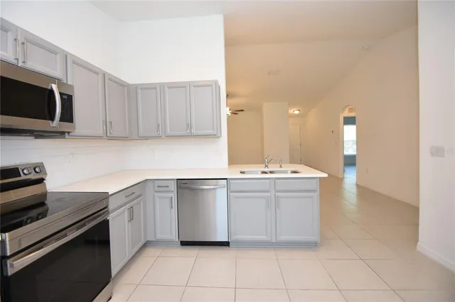 a kitchen with a sink and cabinets