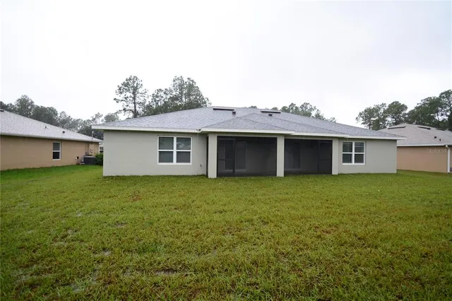 a view of a house with a back yard