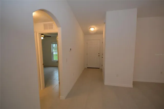 an empty room with closet area