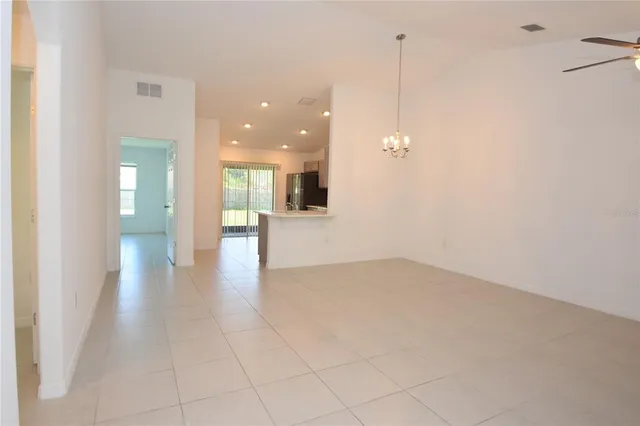 a view of a kitchen with a sink and a window