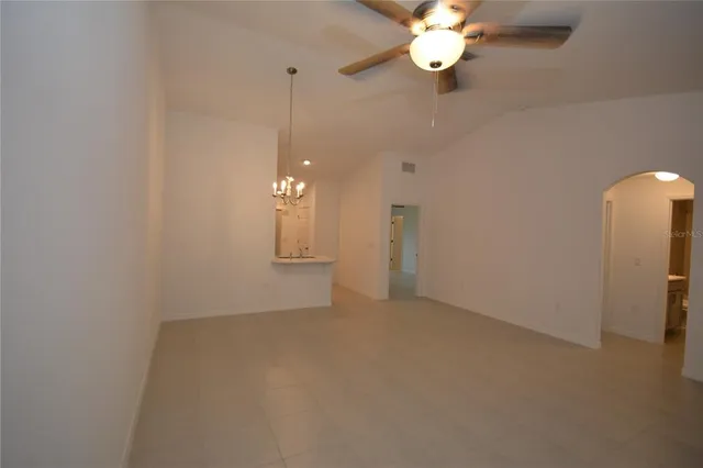 a view of a living room and kitchen with a sink