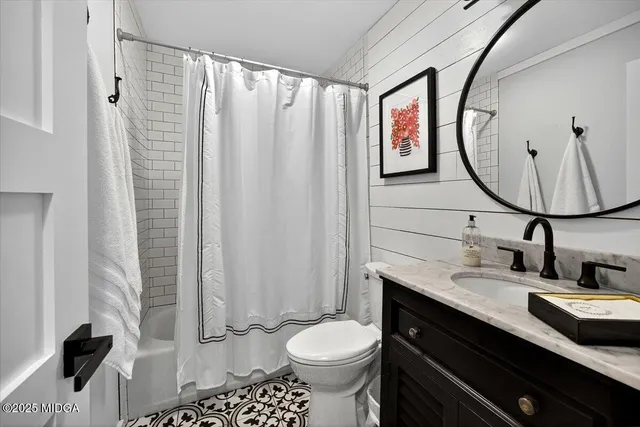 a spacious bathroom with a double vanity sink mirror and double