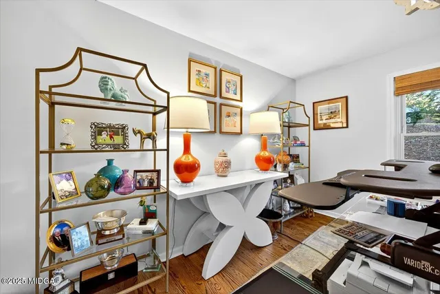 a living room with furniture fireplace and flat screen tv