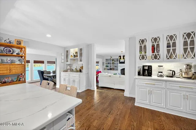 a view of a patio with a table chairs and backyard