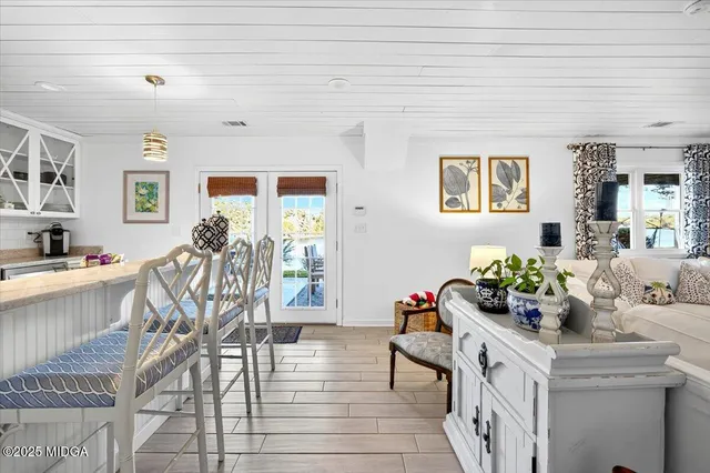 an aerial view of a houses with a lake view